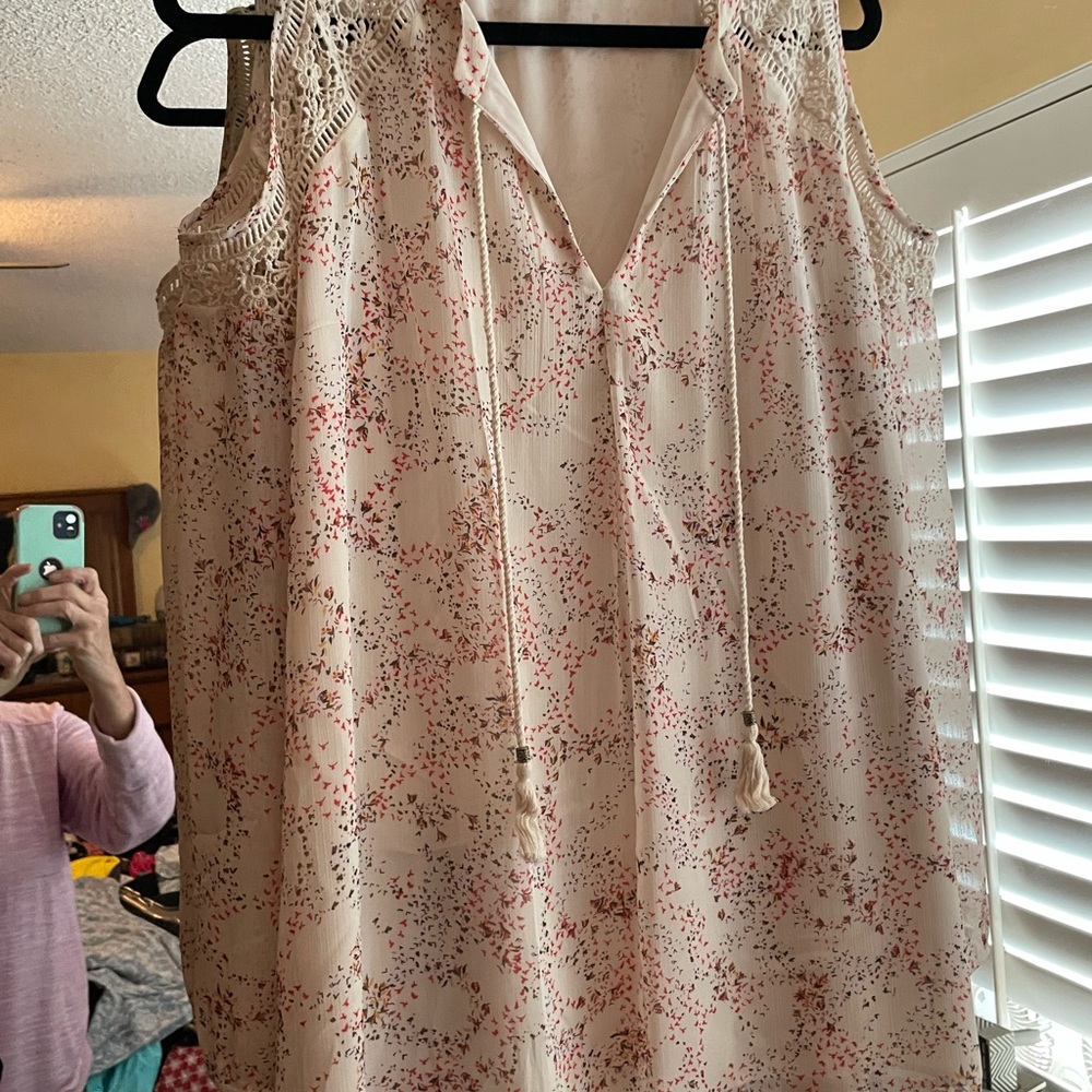 Women’s cold shoulder blouse with fall color print.